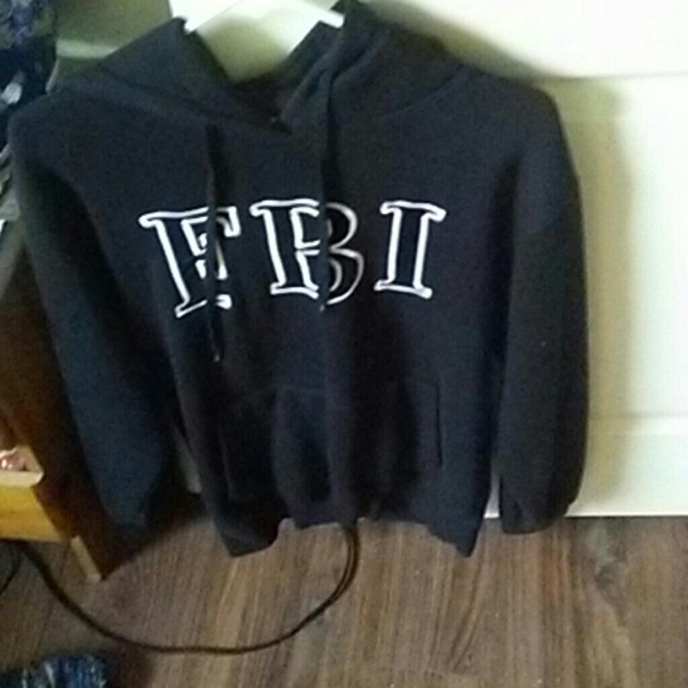 A black FBI  sweater